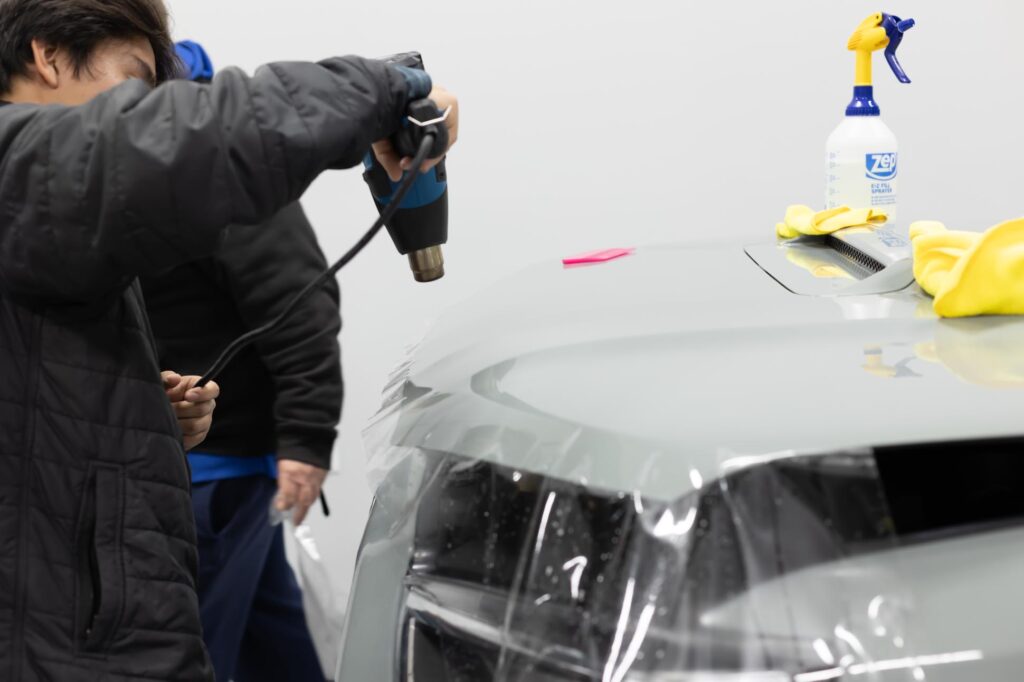 Classic Pinstriping using heat gun while installing PPF paint protection film hood bra in Far North Dallas shop