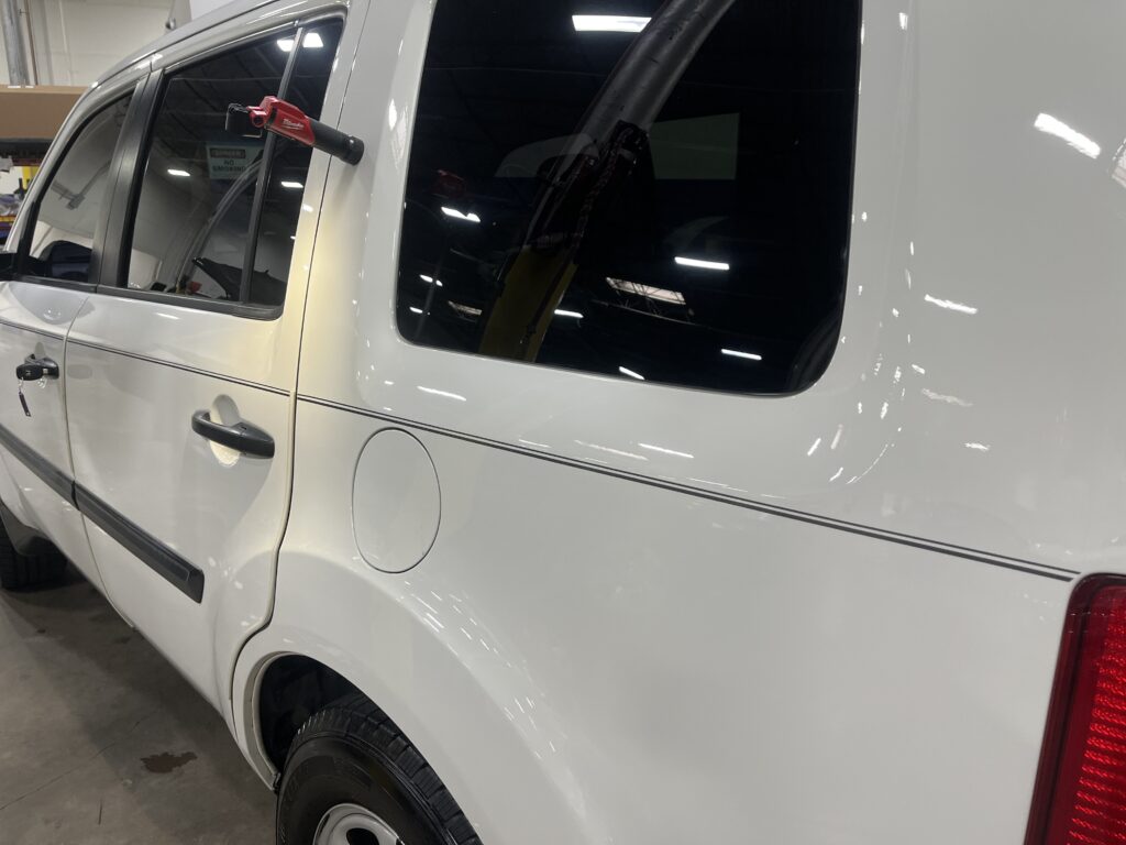 Freshly installed vinyl pinstripes on white suv by Classic Pinstriping in Dallas Texas